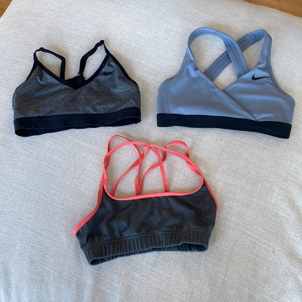 XS sports bras 2 Nike and 1 champion (orange)